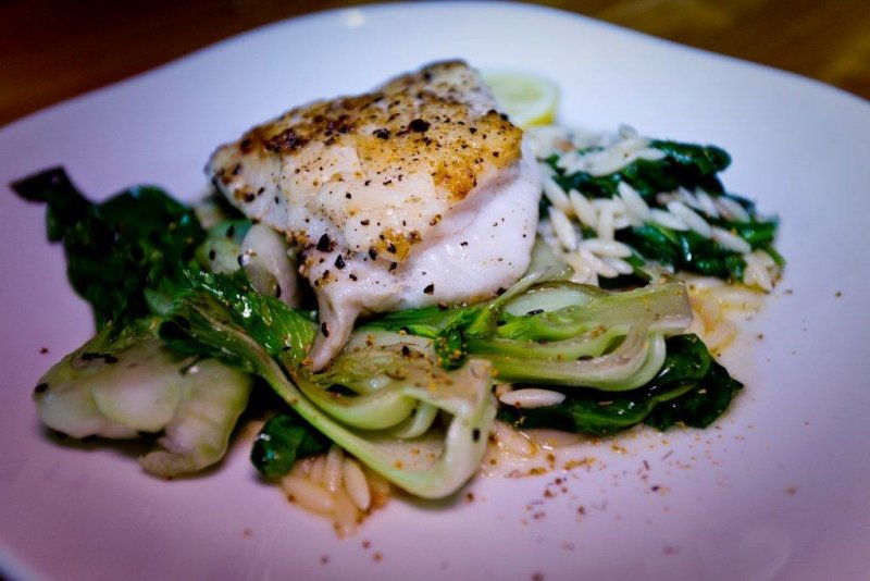 Nut-crusted fresh Alaskan Rockfish served with Asian slaw and creamy coconut rice.
